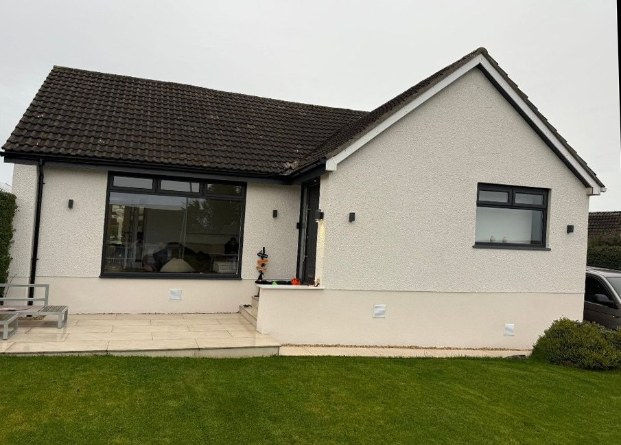 Same bungalow after clean white render finish